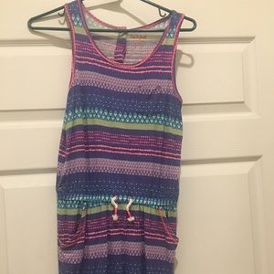 Girls romper.  Never worn. Size 10-12 medium